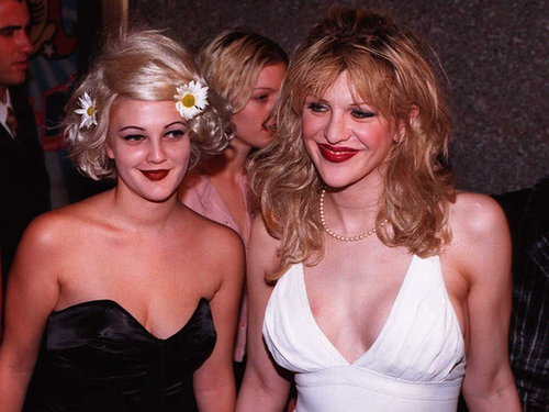 Courtney Love and a young Drew Barrymore hooked up for a photo op at the 1995 VMAs. Both women wore dark red lipstick, but Drew accented her hair with a few daisies, bringing a new meaning to flower child.
Courtney Love and a young Drew Barrymore hooked up for a photo op at the 1995 VMAs. Both women wore dark red lipstick, but Drew accented her hair with a few daisies, bringing a new meaning to flower child.