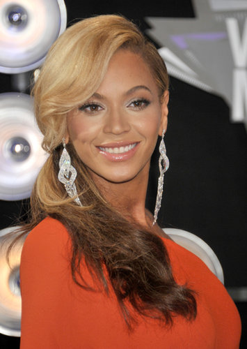 On stage at the 2011 VMAs, Beyoncé Knowles announced her pregnancy in a two-toned ponytail and glowing skin.
On stage at the 2011 VMAs, Beyoncé Knowles announced her pregnancy in a two-toned ponytail and glowing skin.