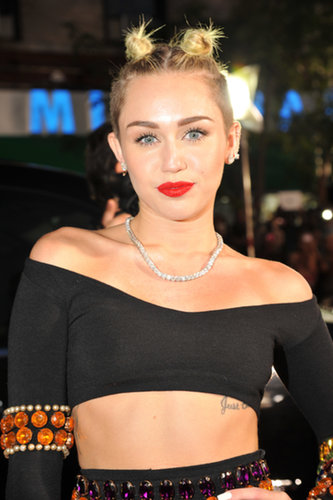 Miley Cyrus pulled her hair up into a double-topknot look with her signature cherry lipstick. Is it us, or are you getting a Gwen Stefani circa 1998 vibe here?
Miley Cyrus pulled her hair up into a double-topknot look with her signature cherry lipstick. Is it us, or are you getting a Gwen Stefani circa 1998 vibe here?