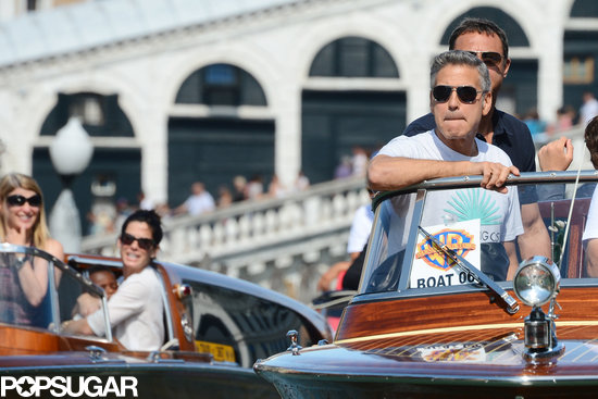 Sandra Bullock and George Clooney rode in side-by-side water taxis in Venice, Italy.
Sandra Bullock and George Clooney rode in side-by-side water taxis in Venice, Italy.