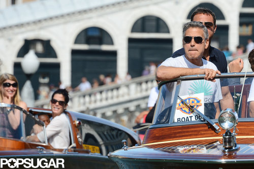 Sandra Bullock and George Clooney rode in side-by-side water taxis in Venice, Italy.
Sandra Bullock and George Clooney rode in side-by-side water taxis in Venice, Italy.