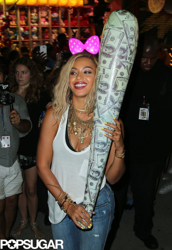 Beyonce wore a bow and carried a big inflatable bat on Coney Island.
Beyonce wore a bow and carried a big inflatable bat on Coney Island.