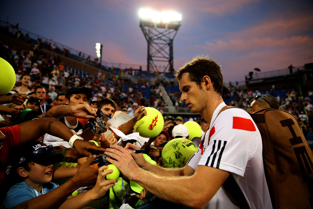 Andy Murray took some time to sign autographs for fans after winning his men's singles second-round match.
Andy Murray took some time to sign autographs for fans after winning his men's singles second-round match.