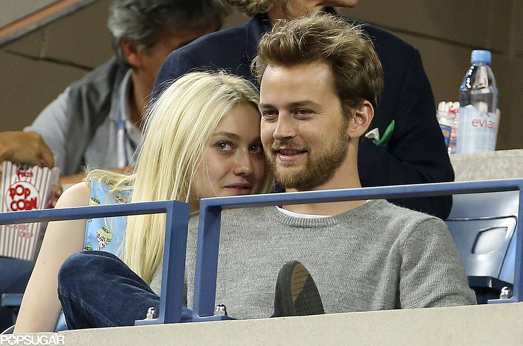 Dakota Fanning cozied up to her boyfriend, Jamie Strachan, during the match.
Dakota Fanning cozied up to her boyfriend, Jamie Strachan, during the match.