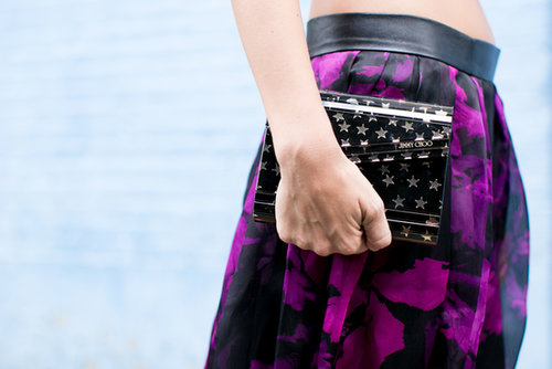 A star-studded Jimmy Choo clutch paired perfectly with a bold camo print.
A star-studded Jimmy Choo clutch paired perfectly with a bold camo print.