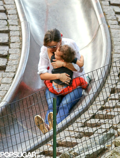 Miranda Kerr cuddled Flynn while taking a ride on the slide at a NYC playground.
Miranda Kerr cuddled Flynn while taking a ride on the slide at a NYC playground.
