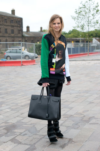 Luxe pieces abound in this cool ensemble, from her Saint Laurent bag to her Givenchy sweatshirt and Isabel Marant boots.
Luxe pieces abound in this cool ensemble, from her Saint Laurent bag to her Givenchy sweatshirt and Isabel Marant boots.