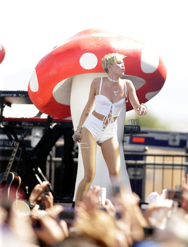 Miley Cyrus performed in front of a giant mushroom.
Miley Cyrus performed in front of a giant mushroom.