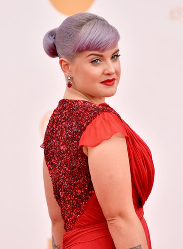 Kelly Osbourne pulled her purple hair into a simple chignon, her blunt bangs swept to the side. Her makeup was highlighted by ruby-red lipstick to match her crimson gown.
Kelly Osbourne pulled her purple hair into a simple chignon, her blunt bangs swept to the side. Her makeup was highlighted by ruby-red lipstick to match her crimson gown.