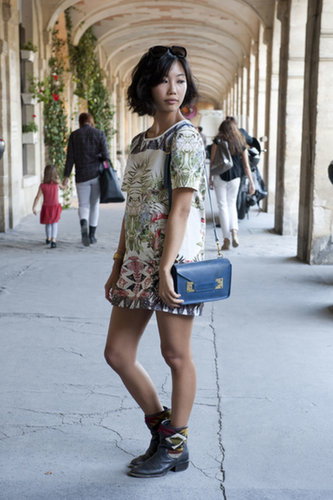 A botanical Zara dress got a tough-girl upgrade with those boots.
A botanical Zara dress got a tough-girl upgrade with those boots.