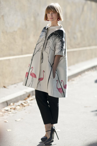 Her coat's decked out in flamingos, but this coat was made for peacocking.
Her coat's decked out in flamingos, but this coat was made for peacocking.