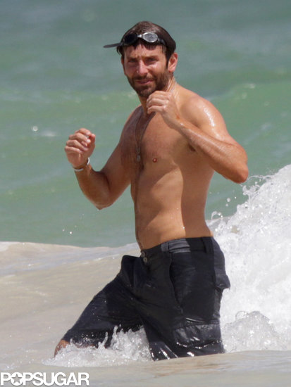Bradley Cooper showed off his fit physique at the beach in Hawaii.
Bradley Cooper showed off his fit physique at the beach in Hawaii.