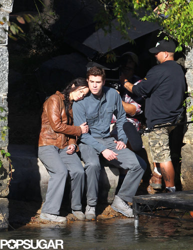 Jennifer Lawrence put her head on Liam Hemsworth's shoulder while filming a scene for Mockingjay.
Jennifer Lawrence put her head on Liam Hemsworth's shoulder while filming a scene for Mockingjay.