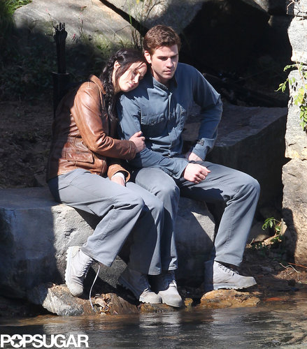Jennifer Lawrence and Liam Hemsworth cuddled up while filming a scene together.
Jennifer Lawrence and Liam Hemsworth cuddled up while filming a scene together.