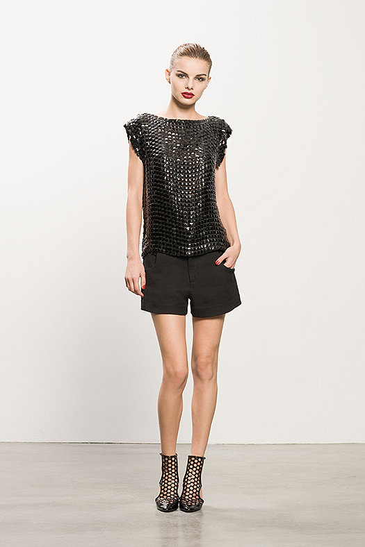 Boatneck Black Beaded Top ($495), Pique Black Shorts ($375), Secret Place Black Open Back Booties ($895)
Photo courtesy of Tamara Mellon
Boatneck Black Beaded Top ($495), Pique Black Shorts ($375), Secret Place Black Open Back Booties ($895)
Photo courtesy of Tamara Mellon