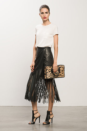 Cashmere Cream Tee ($295), Leather Black Fringe Skirt ($895), Bad Girl Black Sandal Bootie ($750), Diglam Leopard Pony Satchel ($1,195)
Photo courtesy of Tamara Mellon
Cashmere Cream Tee ($295), Leather Black Fringe Skirt ($895), Bad Girl Black Sandal Bootie ($750), Diglam Leopard Pony Satchel ($1,195)
Photo courtesy of Tamara Mellon