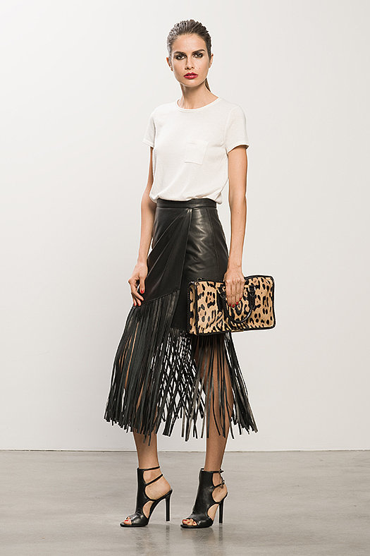 Cashmere Cream Tee ($295), Leather Black Fringe Skirt ($895), Bad Girl Black Sandal Bootie ($750), Diglam Leopard Pony Satchel ($1,195)
Photo courtesy of Tamara Mellon
Cashmere Cream Tee ($295), Leather Black Fringe Skirt ($895), Bad Girl Black Sandal Bootie ($750), Diglam Leopard Pony Satchel ($1,195)
Photo courtesy of Tamara Mellon