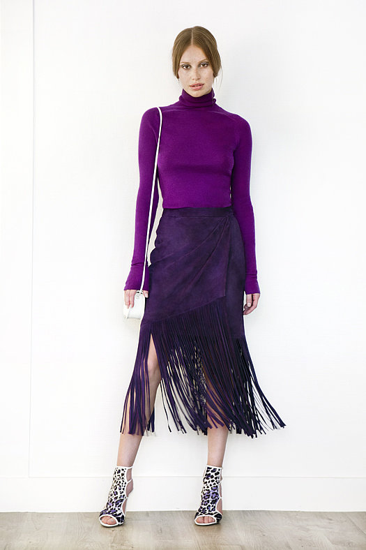 Turtleneck Cashmere Sweater ($495), Suede Fringe Skirt in Purple ($1,195), Trouble Maker Pony Open Toe Sandal Bootie in Grey Leopard ($750), Treasure Watersnake Small Cross Body Bag in Cream ($650)
Photo courtesy of Tamara Mellon
Turtleneck Cashmere Sweater ($495), Suede Fringe Skirt in Purple ($1,195), Trouble Maker Pony Open Toe Sandal Bootie in Grey Leopard ($750), Treasure Watersnake Small Cross Body Bag in Cream ($650)
Photo courtesy of Tamara Mellon