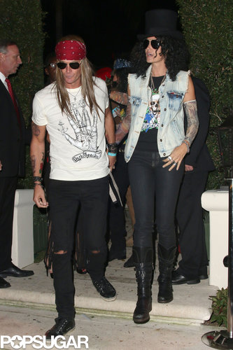 Cindy Crawford and her husband went as Guns 'n' Roses bandmembers Slash and Axl Rose to the Casamigos Halloween Party.
Cindy Crawford and her husband went as Guns 'n' Roses bandmembers Slash and Axl Rose to the Casamigos Halloween Party.