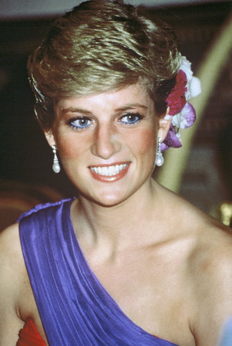 Her blue eyeliner made a comeback, this time paired with silk flowers in her hair and a shoulder-baring dress.
Her blue eyeliner made a comeback, this time paired with silk flowers in her hair and a shoulder-baring dress.
