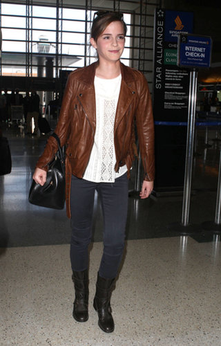 Emma Watson added edgy polish to her airport ensemble with the help of a brown motorcycle jacket and AG velvet jeans.
Emma Watson added edgy polish to her airport ensemble with the help of a brown motorcycle jacket and AG velvet jeans.