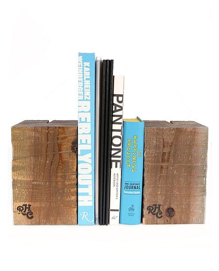 No regifting here. This wood block bookend ($40) is an earthy accent that lends a designer touch.
No regifting here. This wood block bookend ($40) is an earthy accent that lends a designer touch.
