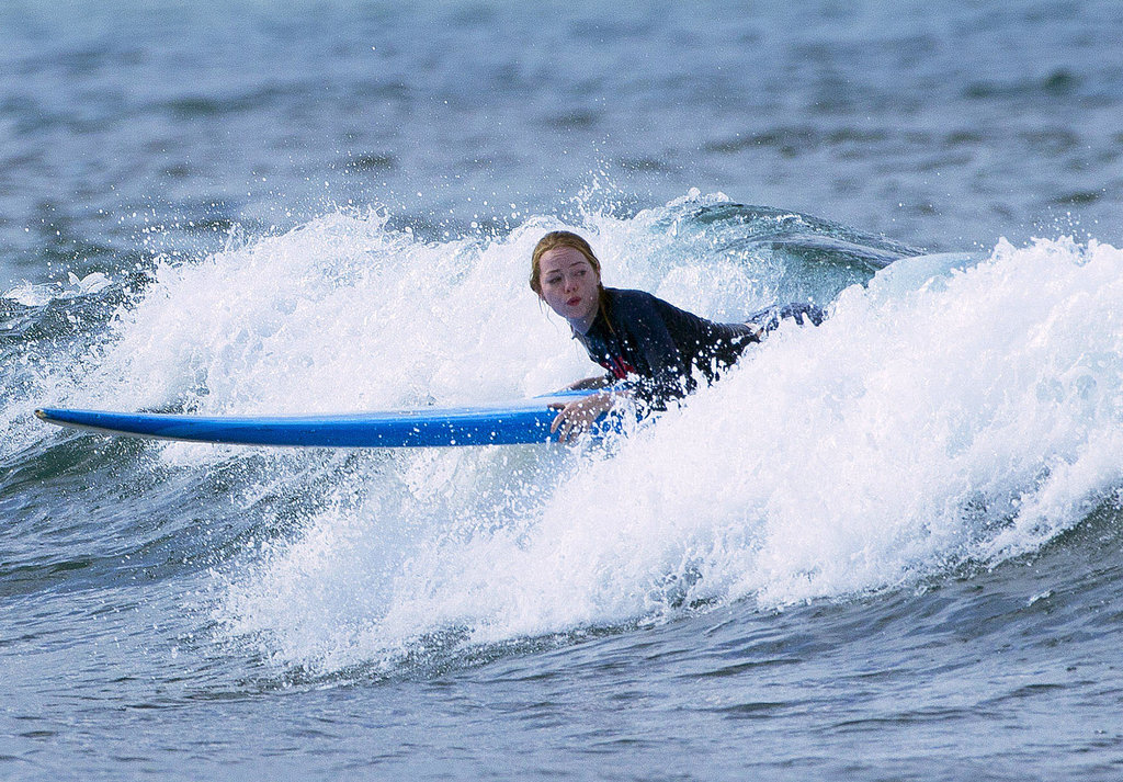 Emma Stone tried to get up during one small wave run. Emma Stone tried to get up during one small wave run.