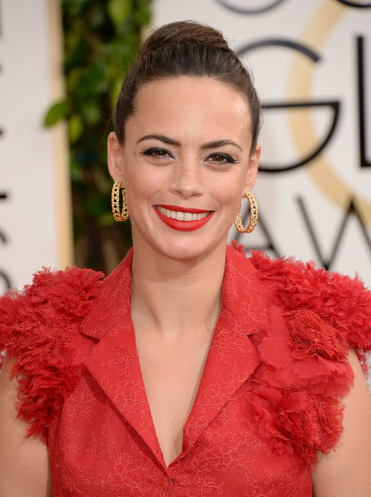 Bérénice Bejo enhanced the vibrancy of her ruffled gown with an equally bold lip color.
Bérénice Bejo enhanced the vibrancy of her ruffled gown with an equally bold lip color.