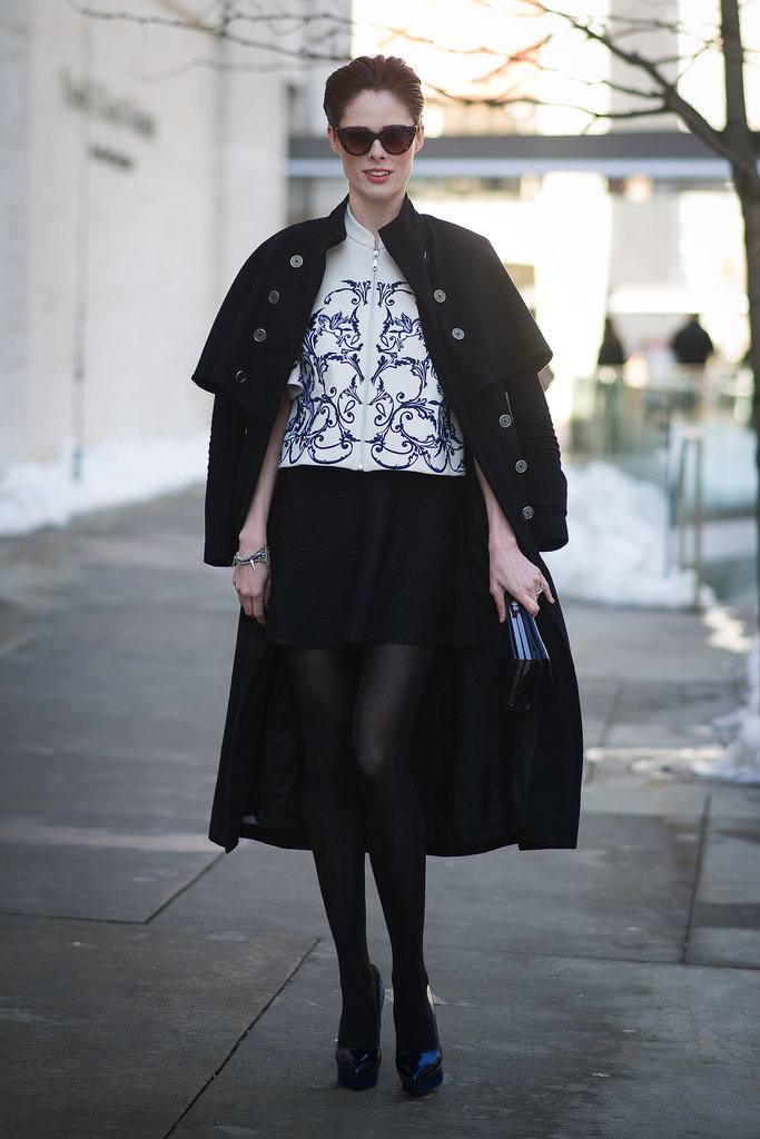 Coco Rocha turned the sidewalk into a runway with a cape draped over her shoulders. 
