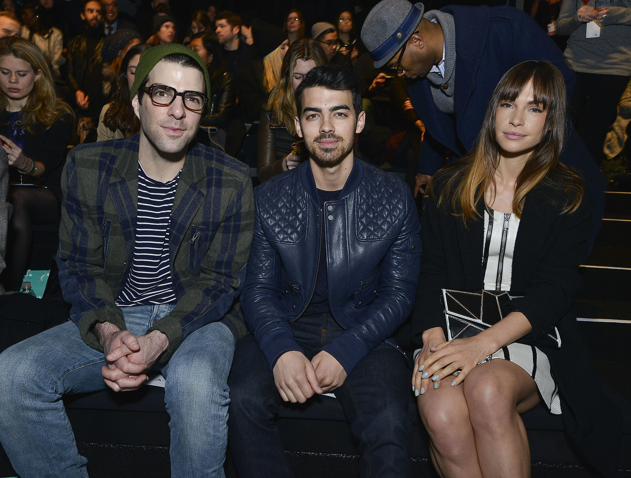 Joe sat between his girlfriend, Blanda, and Zachary Quinto at the