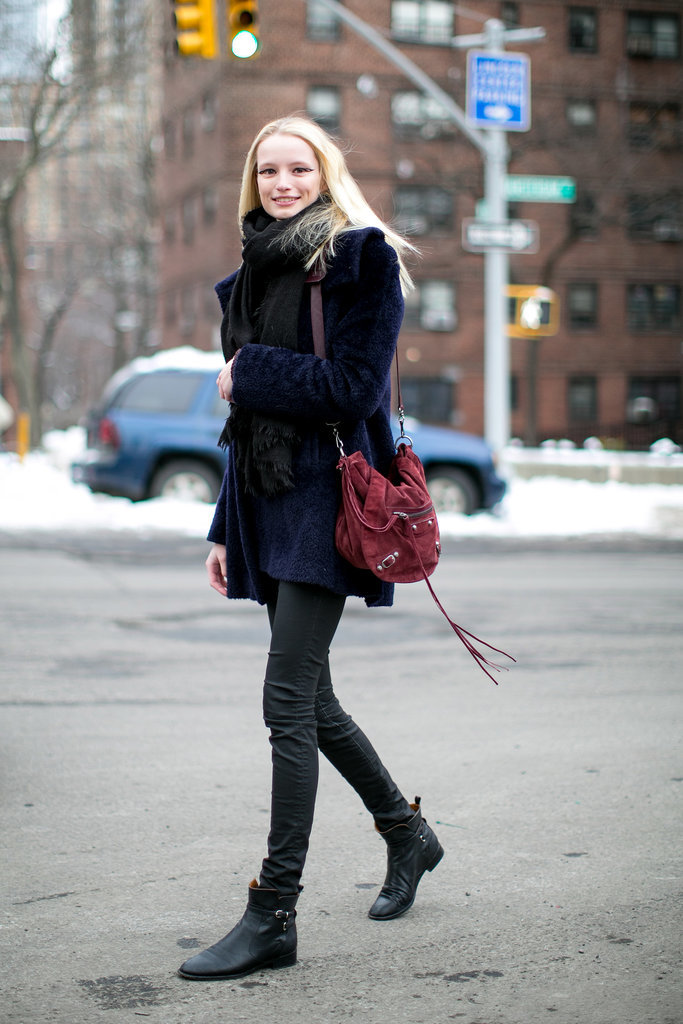 Her outfit might be casual, but there's nothing understated about that cranberry-hued Balenciaga bag. 
