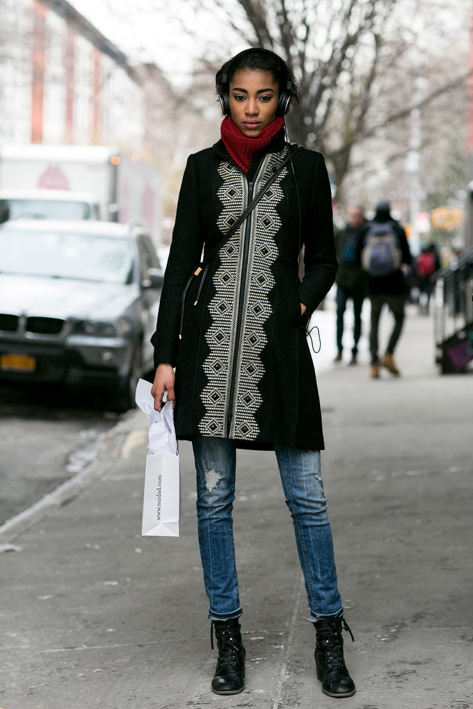 Zipped up in a statement coat. 
