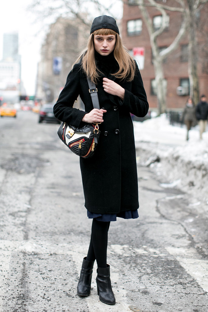 If we didn't know better, we'd think she was shooting an ad for that handbag. 
