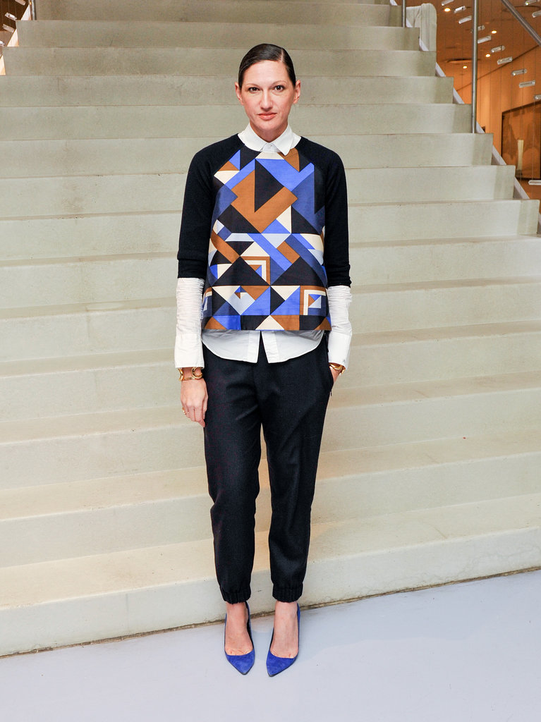 We love that she routinely skips the cocktail dress in favor of an outfit like this combo of black slacks, cobalt pumps, and a geometric print top worn over a button-up shirt.
We love that she routinely skips the cocktail dress in favor of an outfit like this combo of black slacks, cobalt pumps, and a geometric print top worn over a button-up shirt.