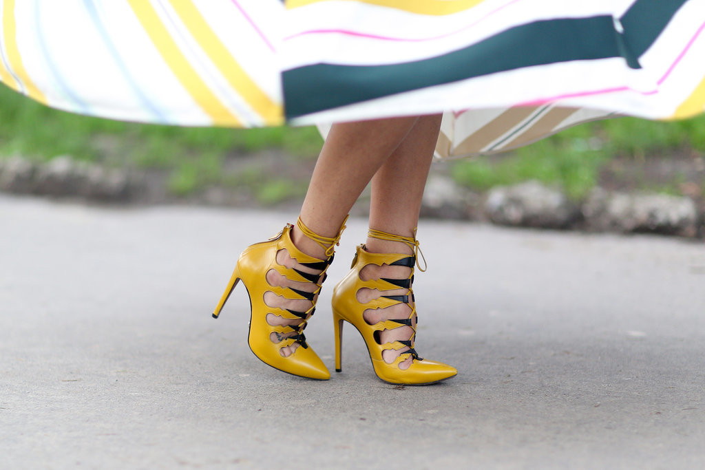 Her totally on-trend lace-up heels also packed a bright color punch.
Her totally on-trend lace-up heels also packed a bright color punch.