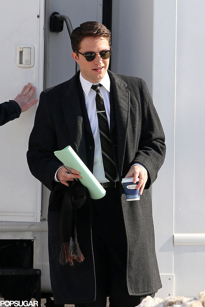 Robert Pattinson debuted new black hair while filming his new movie Life in Toronto. Robert Pattinson debuted new black hair while filming his new movie Life in Toronto.
