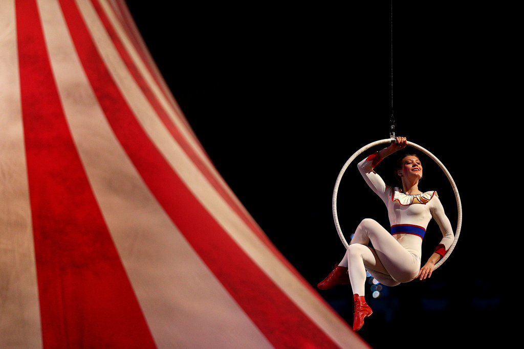 Circus performers danced in hoops.
