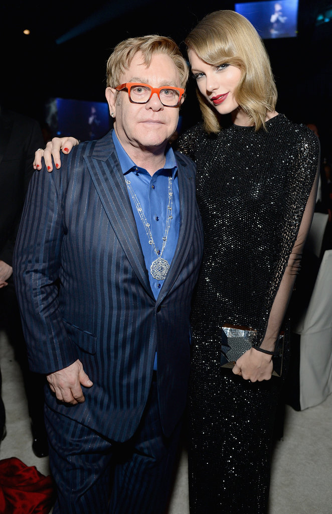 Elton hugged Taylor. Elton hugged Taylor.