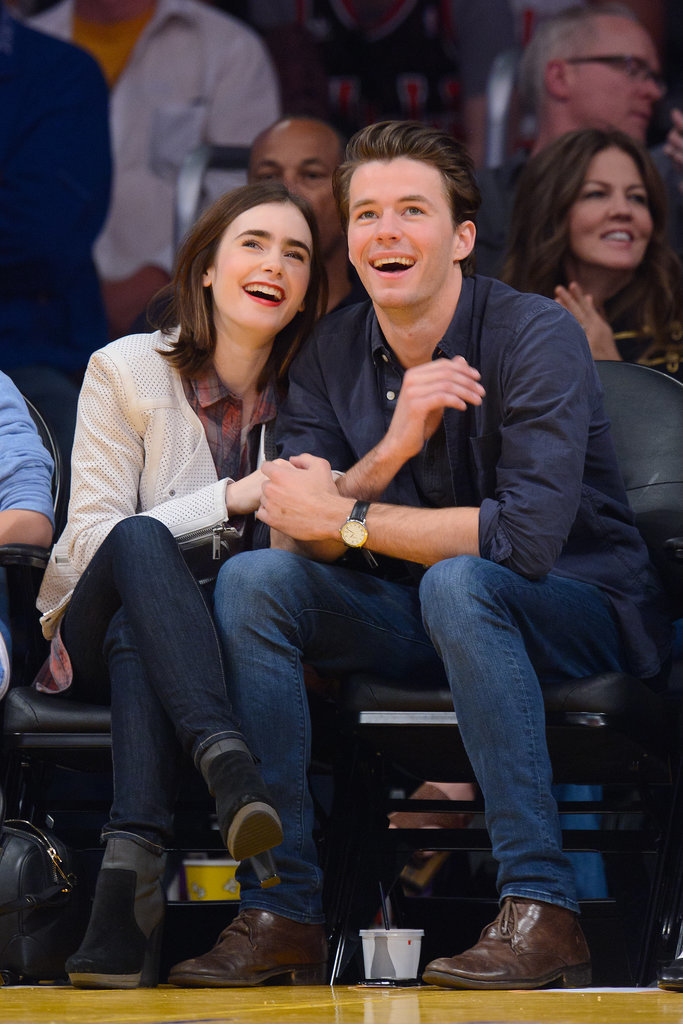 Lily Collins skipped team colors in favor of a perforated leather jacket at a February game.
Lily Collins skipped team colors in favor of a perforated leather jacket at a February game.
