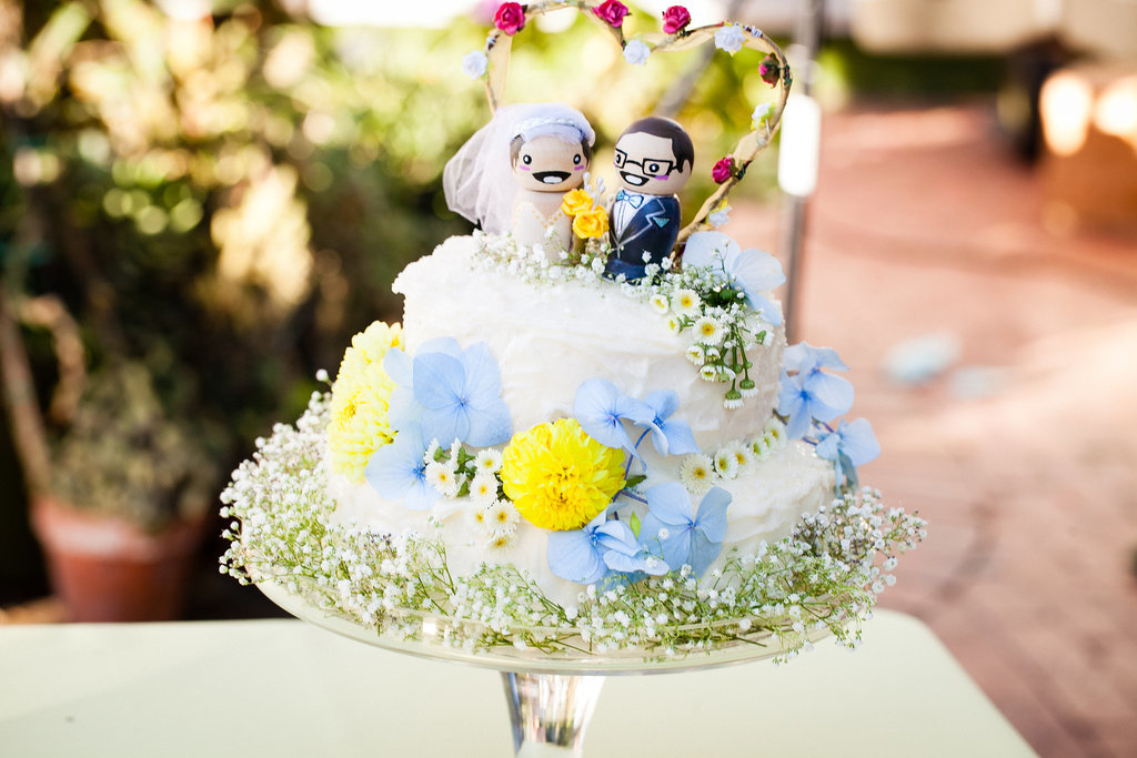 "But truly, we had some incredibly generous friends and family pitching in. Chanti's bench was the deepest: her good friend made our cake — vanilla bean with a raspberry cream filling and buttercream frosting — (which was ah-mazing, by the way), another customized our cake topper, and a combination of our friends and wedding party assembled all the bouquets, table arrangements, and boutonnieres the morning of. Heck, my mother-in-law did my hair! My nails and my makeup were both me, though — that was basically my entire contribution to the wedding."
Photo by G Aranow Photography
"But truly, we had some incredibly generous friends and family pitching in. Chanti's bench was the deepest: her good friend made our cake — vanilla bean with a raspberry cream filling and buttercream frosting — (which was ah-mazing, by the way), another customized our cake topper, and a combination of our friends and wedding party assembled all the bouquets, table arrangements, and boutonnieres the morning of. Heck, my mother-in-law did my hair! My nails and my makeup were both me, though — that was basically my entire contribution to the wedding."
Photo by G Aranow Photography
