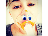 Miley Cyrus Wears Duck-Face Oxygen Mask, Postpones U.S. Bangerz Tour Miley Cyrus Wears Duck-Face Oxygen Mask, Postpones U.S. Bangerz Tour