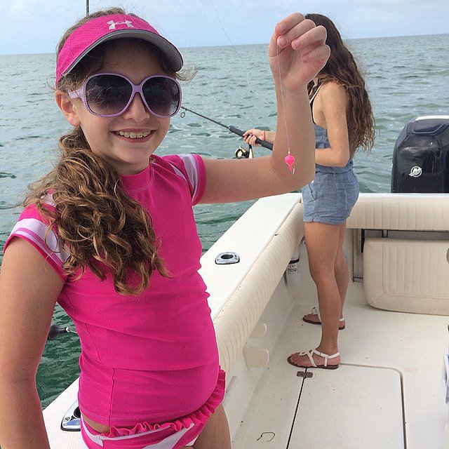. . . Which She Wears While Fishing . . . Which She Wears While Fishing