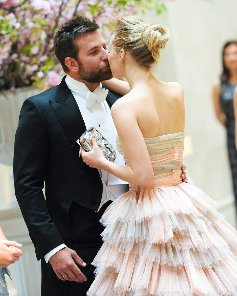 Bradley Cooper and Suki Waterhouse stopped for a kiss on their way into the party.
Bradley Cooper and Suki Waterhouse stopped for a kiss on their way into the party.