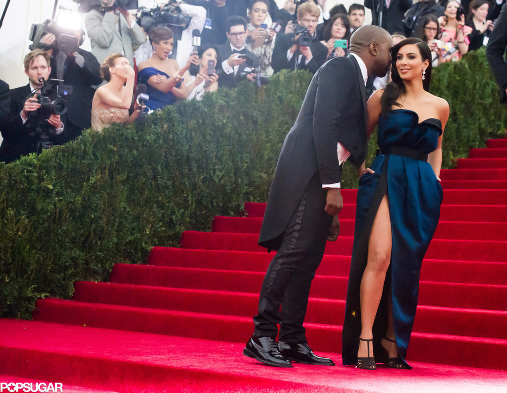 Kanye West whispered in Kim Kardashian's ear during their red carpet run.
Kanye West whispered in Kim Kardashian's ear during their red carpet run.