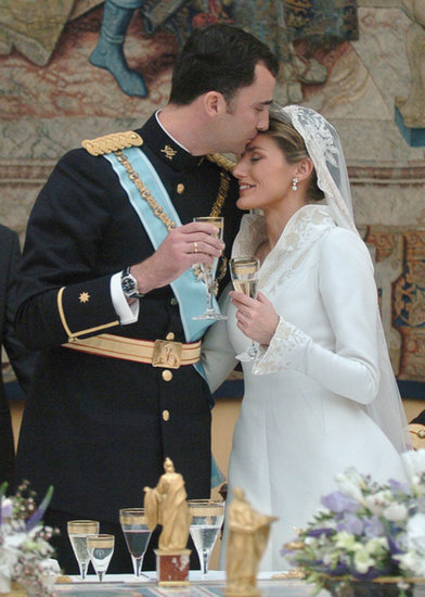 In May 2004, Felipe gave Letizia a tender kiss on their wedding day. In May 2004, Felipe gave Letizia a tender kiss on their wedding day.