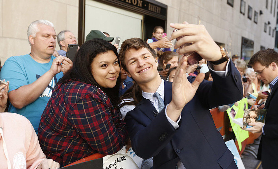 The Fault in Our Stars' Ansel Elgort snapped a selfie with a fan in NYC in June 2014.
The Fault in Our Stars' Ansel Elgort snapped a selfie with a fan in NYC in June 2014.