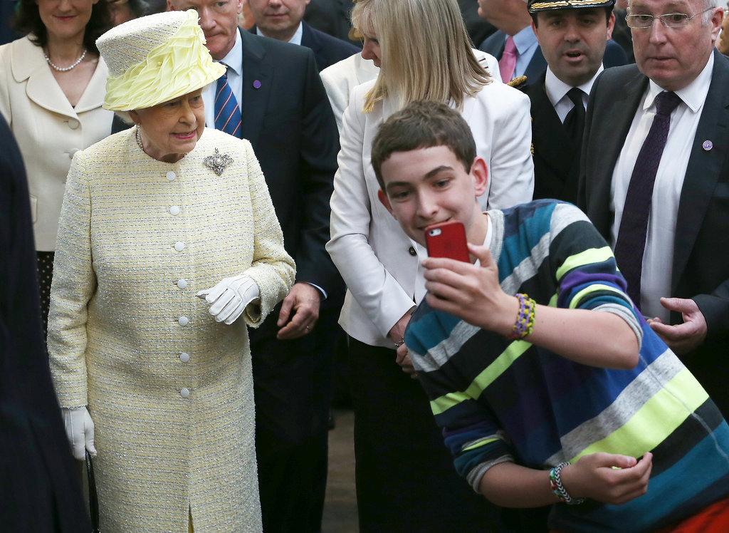 A boy in Belfast, Northern Ireland, boldly snapped a selfie with Queen Elizabeth II when she visited his town in June 2014.<br />
