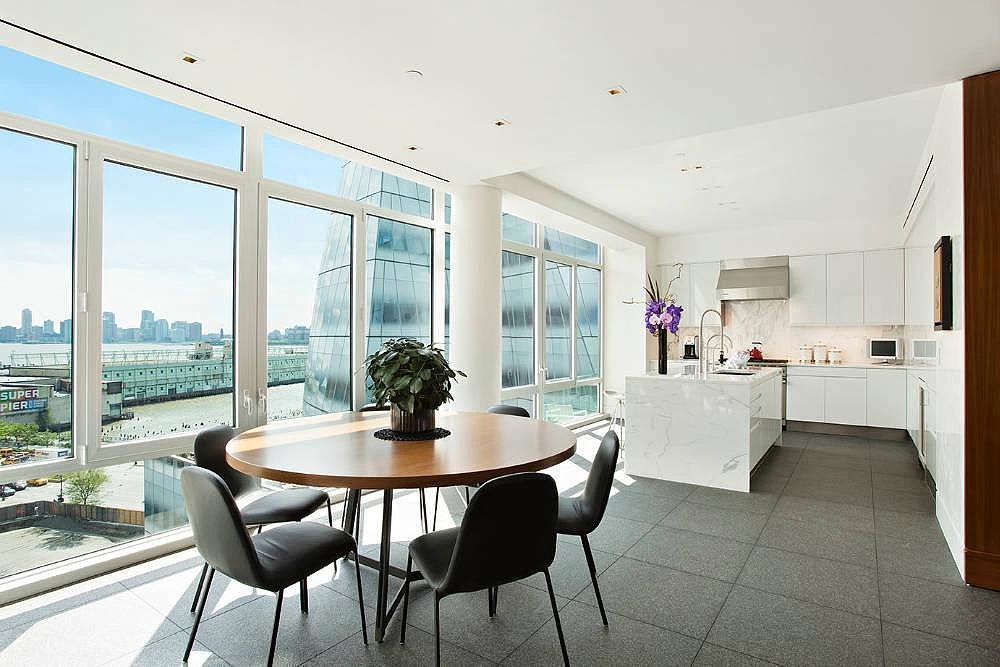 The bright and airy kitchen includes a breakfast nook.
Source: Town Real Estate
