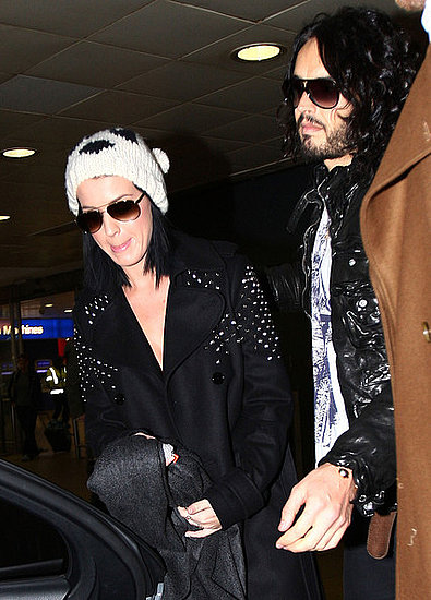 Russell Brand picks up girlfriend Katy Perry as she arrives at Heathrow Airport in London