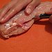 Cut the larger chicken breast piece in half crosswise.